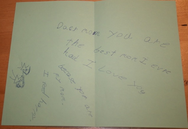 Note found in book which reads: 'Daer mom you are the best mom I evre had I love you because you are my mom. I feel happy'